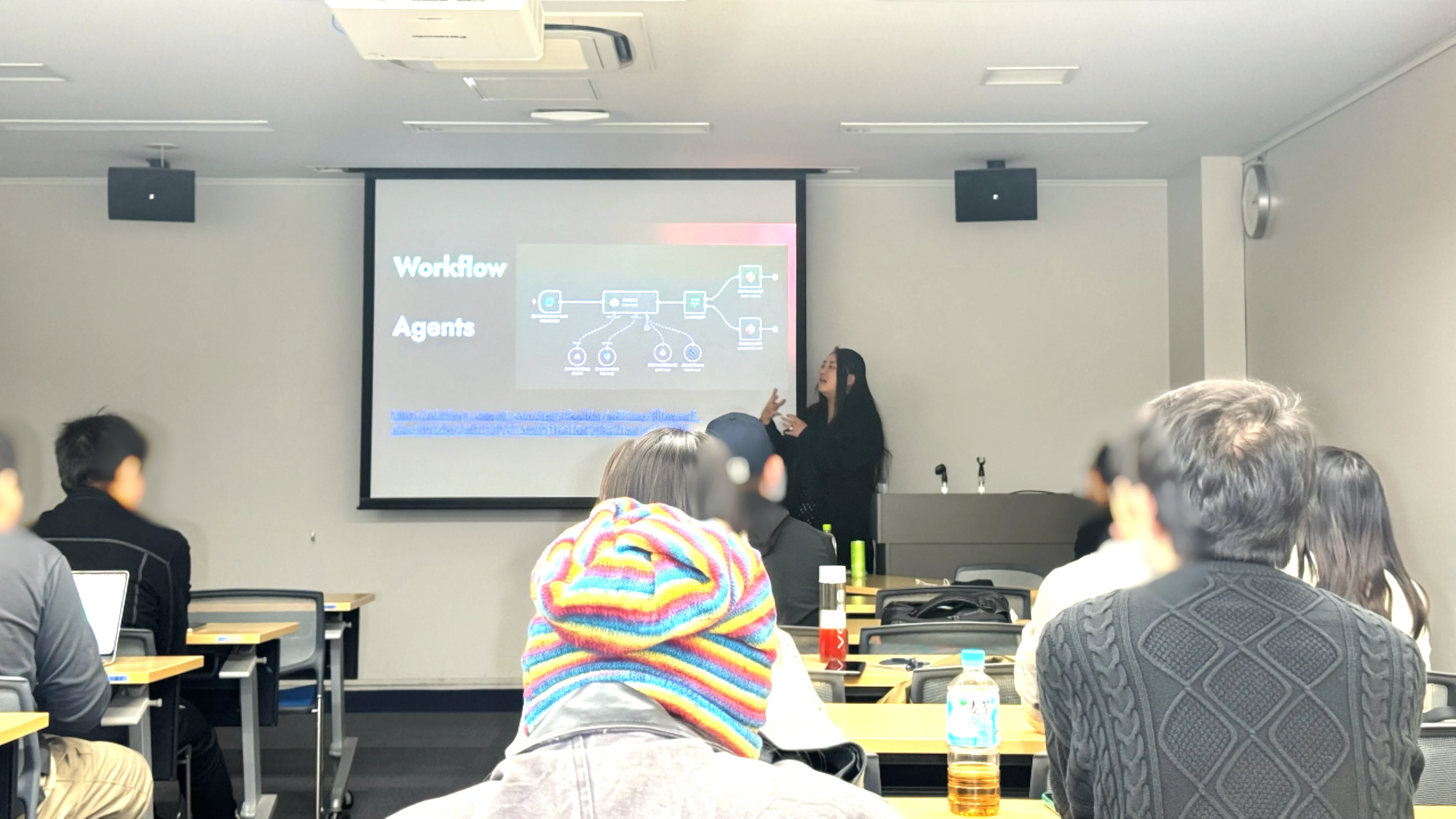Kaitan sharing AI insights during a technical exchange in Tokyo